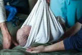 A baby in a swaddling cloth