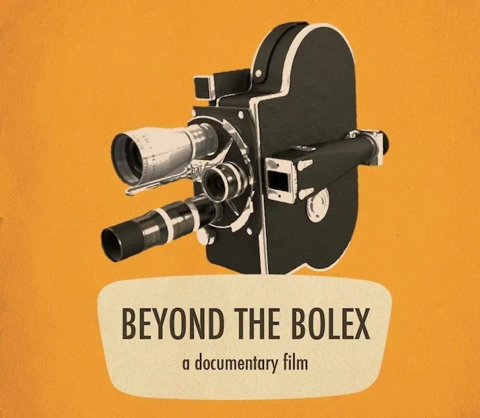 Bolex Camera against an orange backdrop