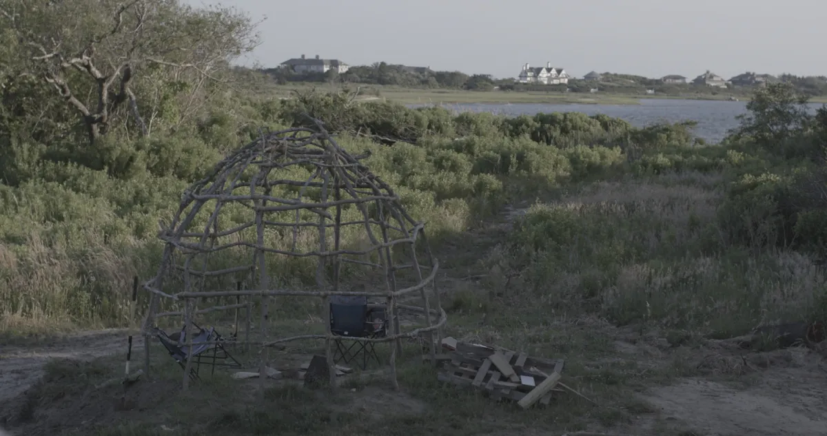 structure of indigenous building overlooks development neighborhood of the Hamptons