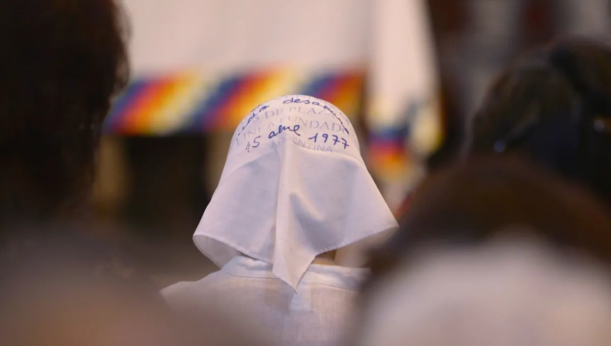 a woman in a white headscarf