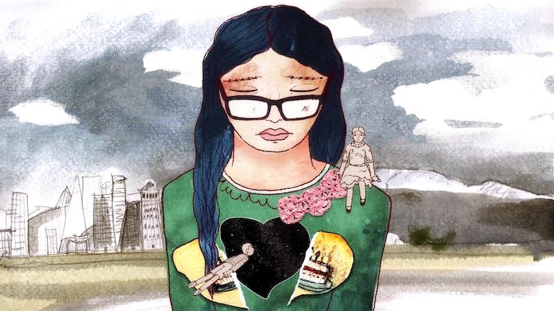 A 2D animated watercolor painted image of a girl wearing glasses with long, dark black hair, wearing a green sweater with a yellow broken heart and a pink ribbon on the shoulder. Her eyes are closed and she faces downward looking a bit sad. Another girl in a dress painted grey sits on her shoulder, and a boy painted the same color grey floats in front of her. The girl in glasses is against a grey, cloudy sky with a cityscape of highrise buildings in the distance behind her.