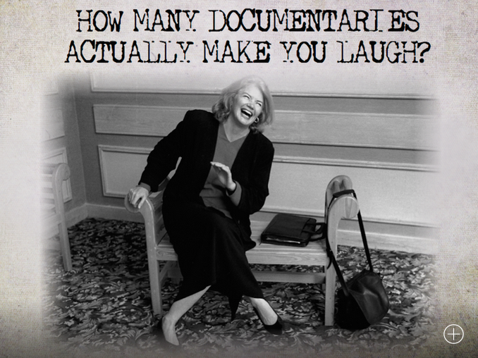 Molly Ivins laughs on a bench in business attire
