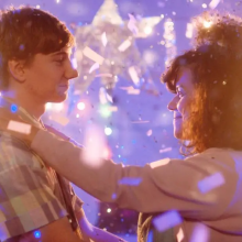 Photo credit: Brennan Vance. Film: You Were My First Boyfriend. Two people dancing with confetti falling around them.