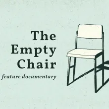 The image has a light green background. On the right of the image is a sketched chair with dark green outlines and an off-white fill. The chair has a dark green shadow stretched out behind it. To the left of the chair is dark green text in a serif font that reads "The Empty Chair" followed by the subtitle "a feature documentary".