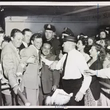 A 1943 NYWTS photo of Frank Sinatra mobbed by fans, found in the Library of Congress. The photo's cutline reads: "It took all these Pasadena, Calif., policemen, if you can believe the story, to rescue singer Frank Sinatra from the hordes of fans that beseiged him when he got off his train at Pasadena. Looks like that old black magic is really taking hold in California."