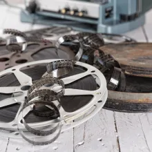 Rolls of film lay out on a table. 