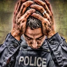 Stylized close-up of a police officer looking down, with their hands on their head