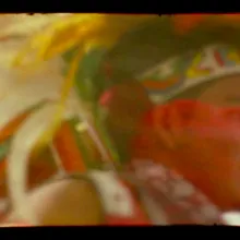Still image from Colectivo Los Ingrávidos' "Tierra en Trance," showing the edges of a 16mm film still with a dancer wearing a traditional headdress.