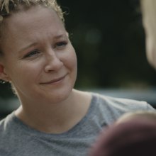 Film still from Reality Winner, of Reality Winner reuniting with her family after being released from prison. Image credit: E.J. Enríquez