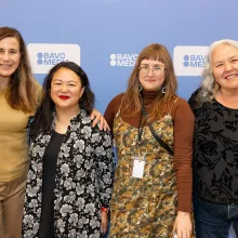 Four people stand in front of a BAVC Media step-and-repeat.