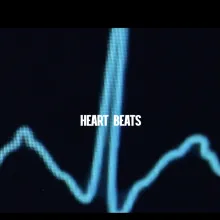 Heart Beats in white lettering over a background of a heart monitoring machine.