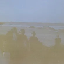 An artfully obscured photo of a group of people in an outdoor setting. 