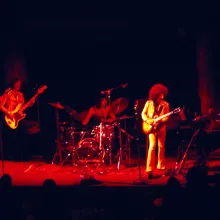 Slightly blurry image of a band performing.