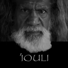 Black and white portrait of a man with long hair and a white beard. The text "'Iouli" below the portrait.