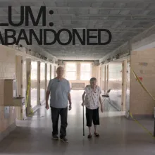 A senior aged brother and sister walking down the hallway of an empty wing at the Sheboygan County Hospital.