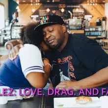 Bubblez and his teenage daughter hug while sitting at a table at a coffee shop.