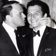 Buddy Greco with Frank Sinatra giving him a kiss on the cheek