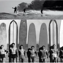 Black and white photo of a group of surfers lining up and holding surfboards