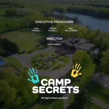 A DRONE IMAGE OF CAMP HEARTLAND  WITH CAPTION TITLES