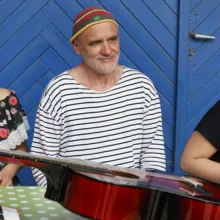  Mr. Bachmann is an elderly German school teacher, seen here with two smiling female students. From Maria Speth’s ‘Mr. Bachmann and his Class.’ Courtesy of Madonnen Film 