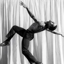 Alvin Ailey is a legendary Black male dancer, photographed on stage, in a ballet pose. From Jamila Wignot’s ‘Ailey.’ Courtesy of Jacob's Pillow / Licensed from Harvard (John Lindquist rights)