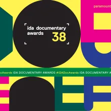 Colorful banner for the 38th IDA Documentary Awards, December 10, 2022 at Paramount Theater, Los Angeles.