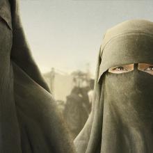 Two animated women in black niqabs.
