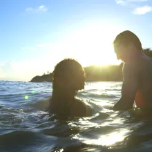a person is swimming in a lake