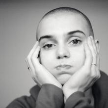 Sinéad O’Connor in a black and white photo.