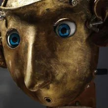 A metal sculpture of a head
