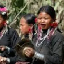 Southeast Asian woman perform traditional instruments