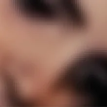 Pixelated abstract image of a woman's face.