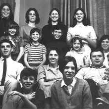 large family poses for black and white picture