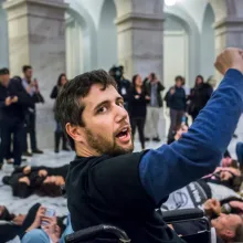 An activist in his wheel chair in the Capital