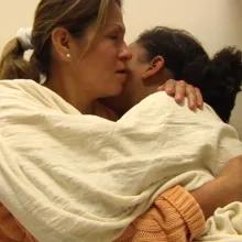 A mother hugs her daughter in a psychiatric hospital