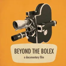 Bolex Camera against an orange backdrop