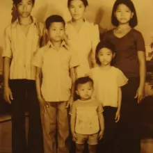 An old portrait photo of a family of six.