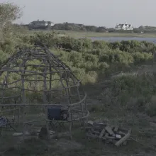 structure of indigenous building overlooks development neighborhood of the Hamptons