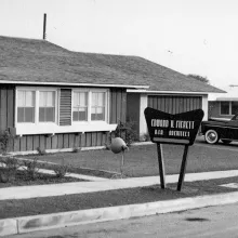 A black and white photograph of a mobile home.