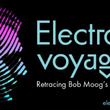 "Electronic voyager" written in blue text over a black background, with the sideview image of a man's head next to it