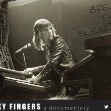 Keith Emerson is playing the piano during a concert.