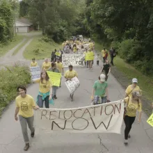 protesters from the town of Minden, WV hold signs about local contamination