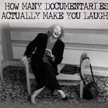 Molly Ivins laughs on a bench in business attire