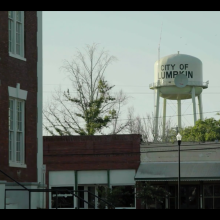 The city of Lumpkin Water Tower looms over the empty Old Town streets