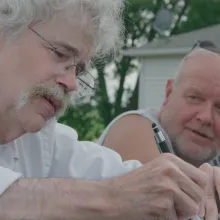 Pulitzer prize winning journalist Art Cullen in scene of Storm Lake film