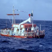 The Alcali Vessel at sea with the crew on deck.