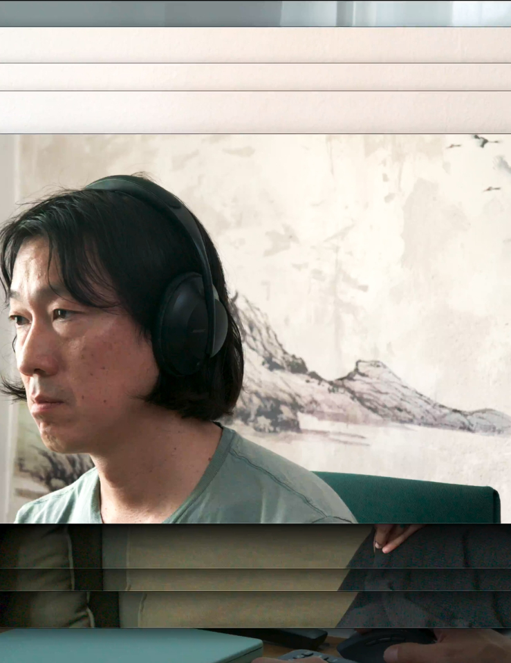 The image of a middle-aged Asian man with long black hair parted in the middle wears headphones and a light green t-shirt hovers over a repeated image of two people sitting on a green couch