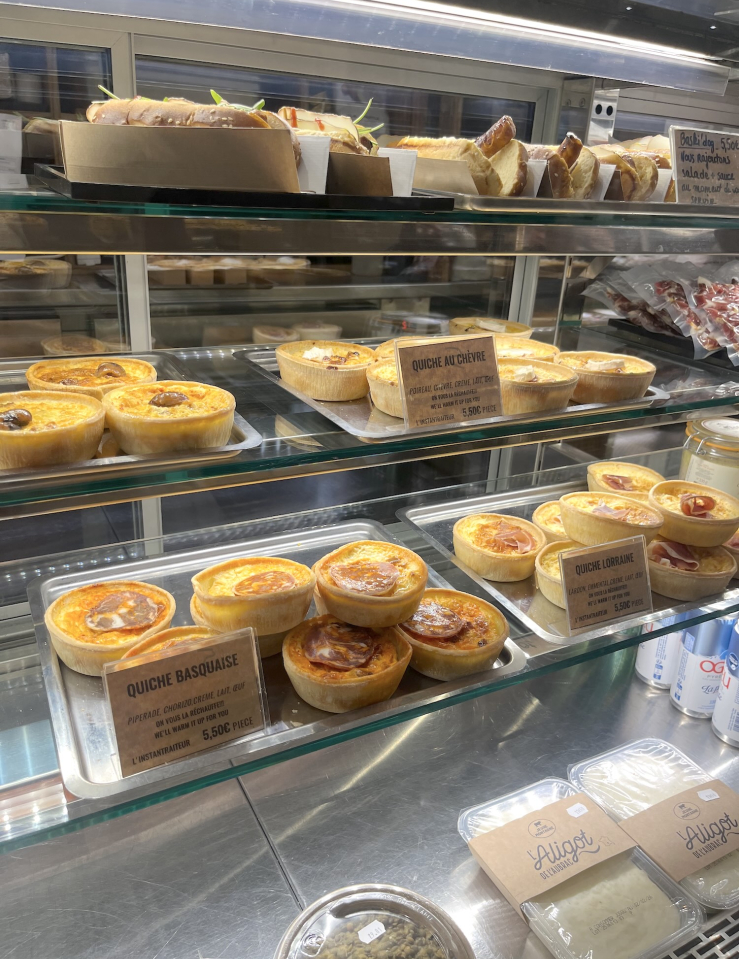 A case of quiche at a bakery.