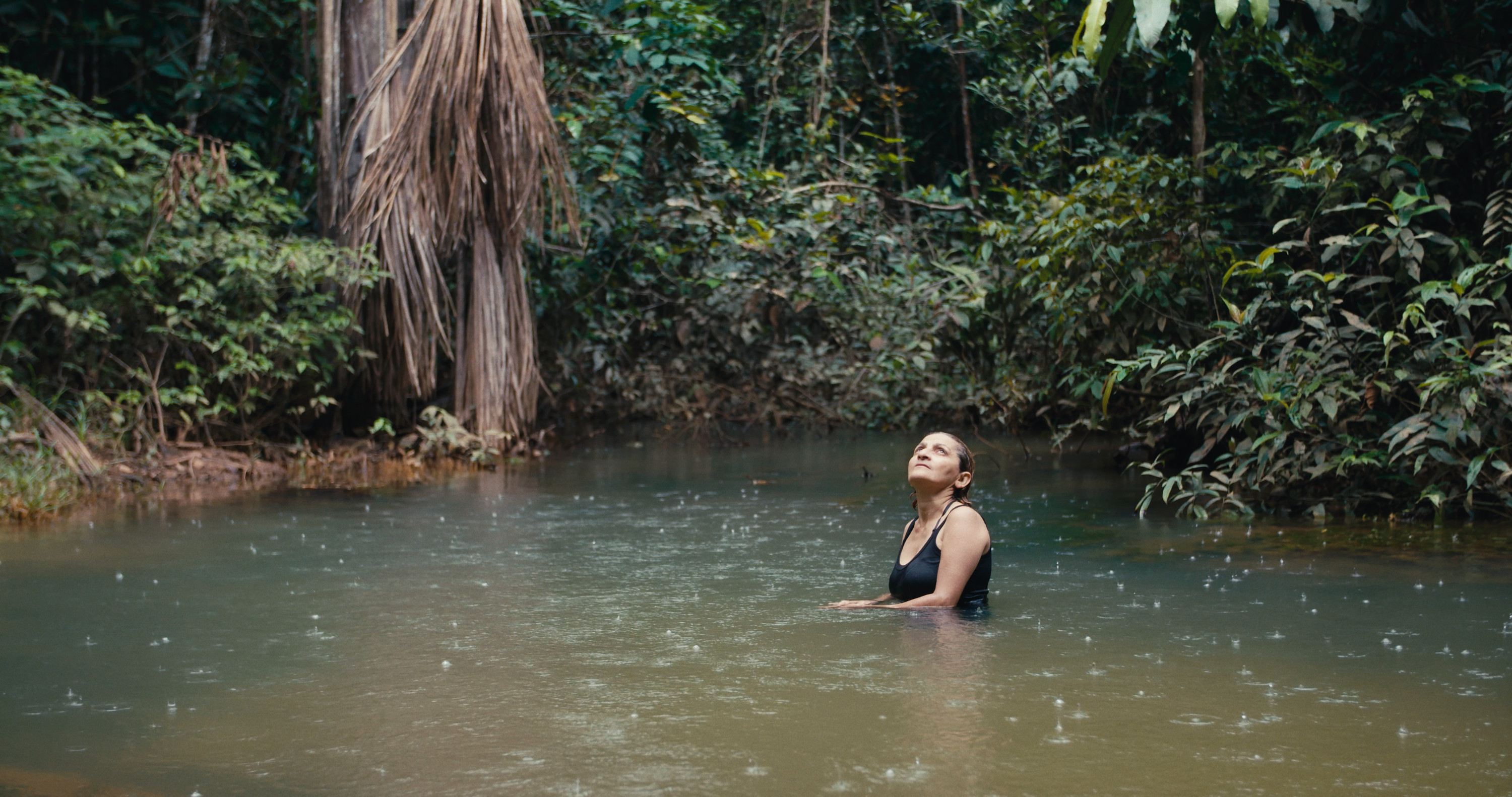 A woman bathing in a river in the Amazon rain forest. From Alex Pritiz's 'The Territory.' Courtesy of Camden International Film Festival